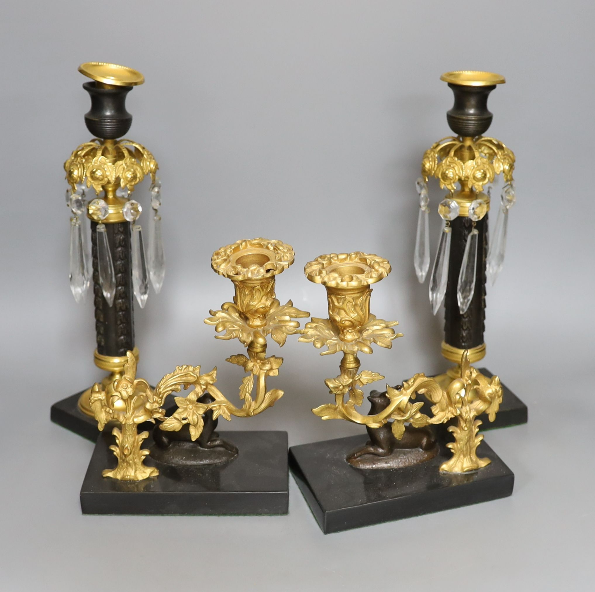 A pair of Empire-style bronze and brass table lustres, 29cm, and a pair of similar candlesticks